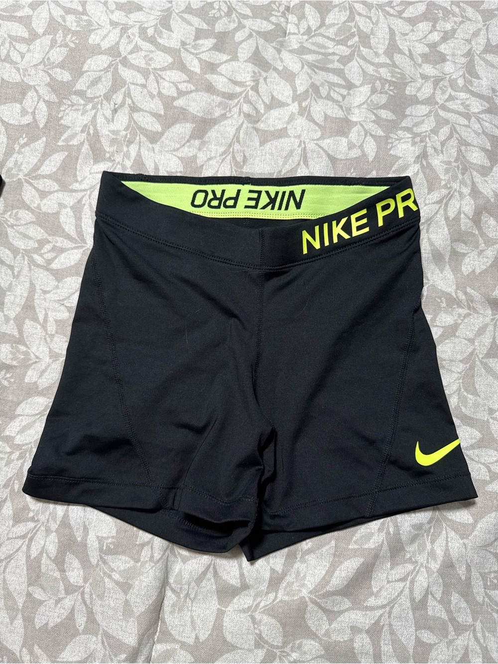 Nike Black Women's Athletic Shorts with Neon Yellow Accents